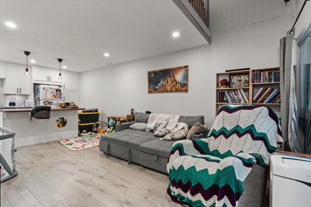 Living room with vaulted ceiling and loft above at 915 34909 Old Yale Road