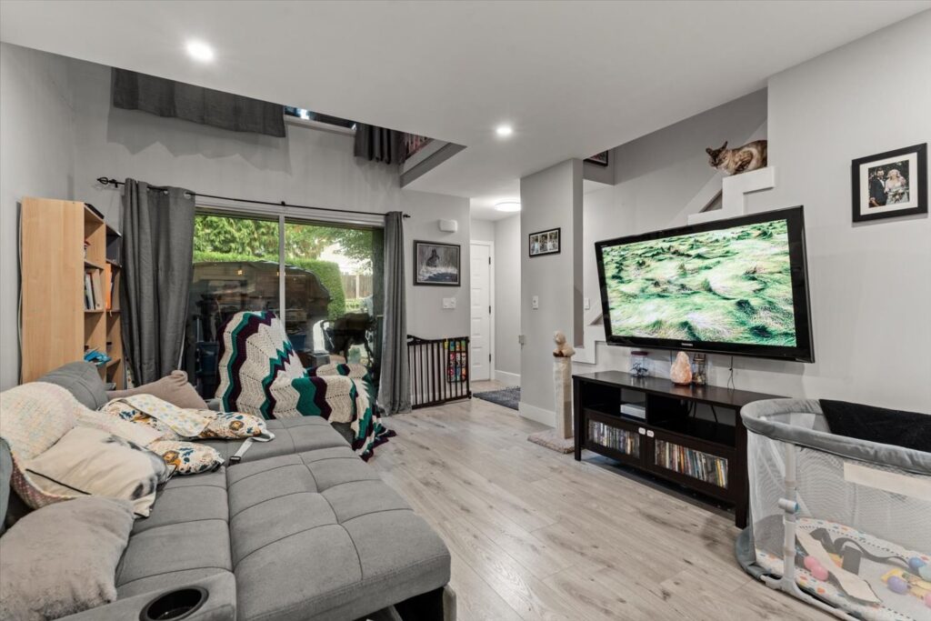 Living room with sliding door to the patio at 915 34909 Old Yale Road