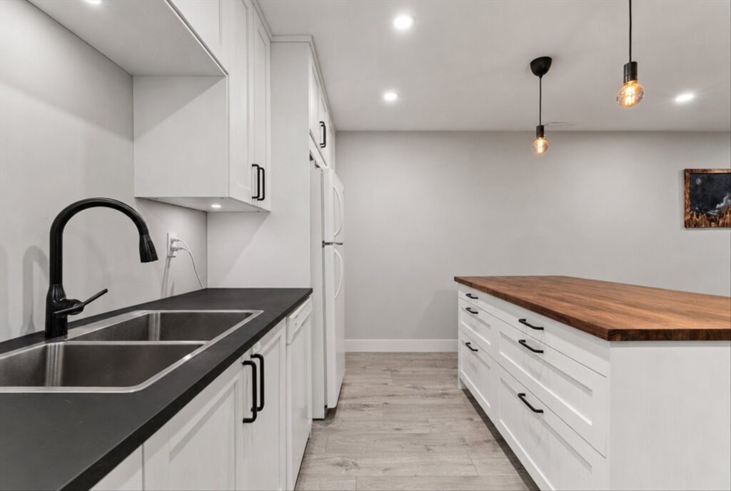 Kitchen with white shaker cabinets, digitally decluttered, at 915 34909 Old Yale Road