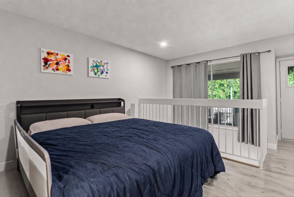 Loft primary bedroom, digitally decluttered, at 915 34909 Old Yale Road