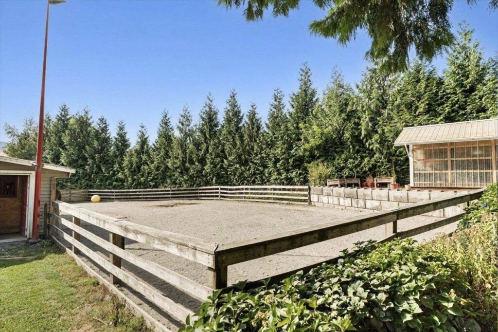 Fenced sand paddock and greenhouse at 42420 Adams Road
