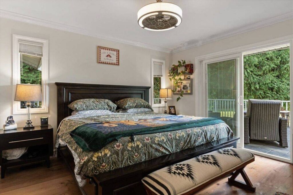 Primary bedroom with a slider to the deck at 42420 Adams Road