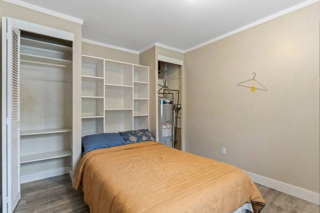 Bedroom with built in shelving at 28 3942 Columbia Valley Road