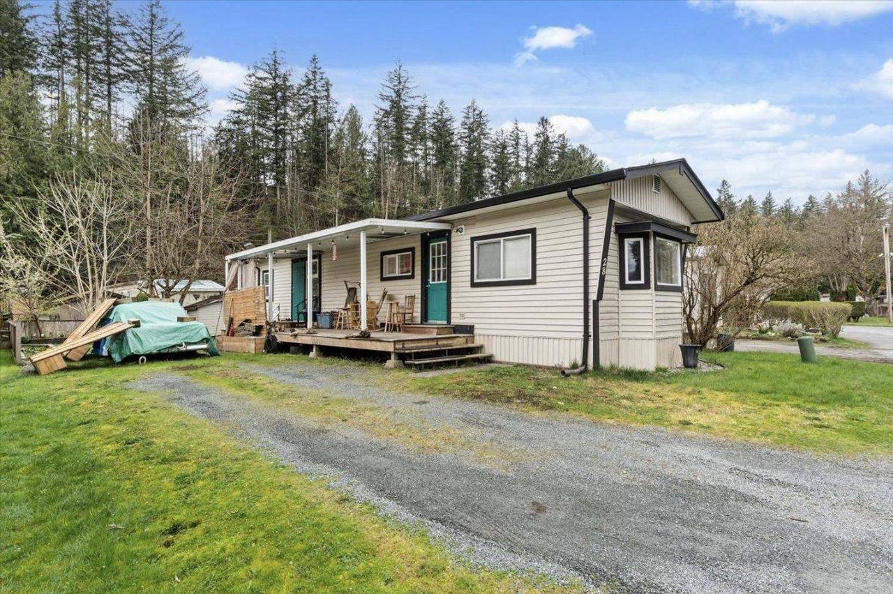Home with a covered deck and gravel drive at 28 3942 Columbia Valley Road, Cultus Lake