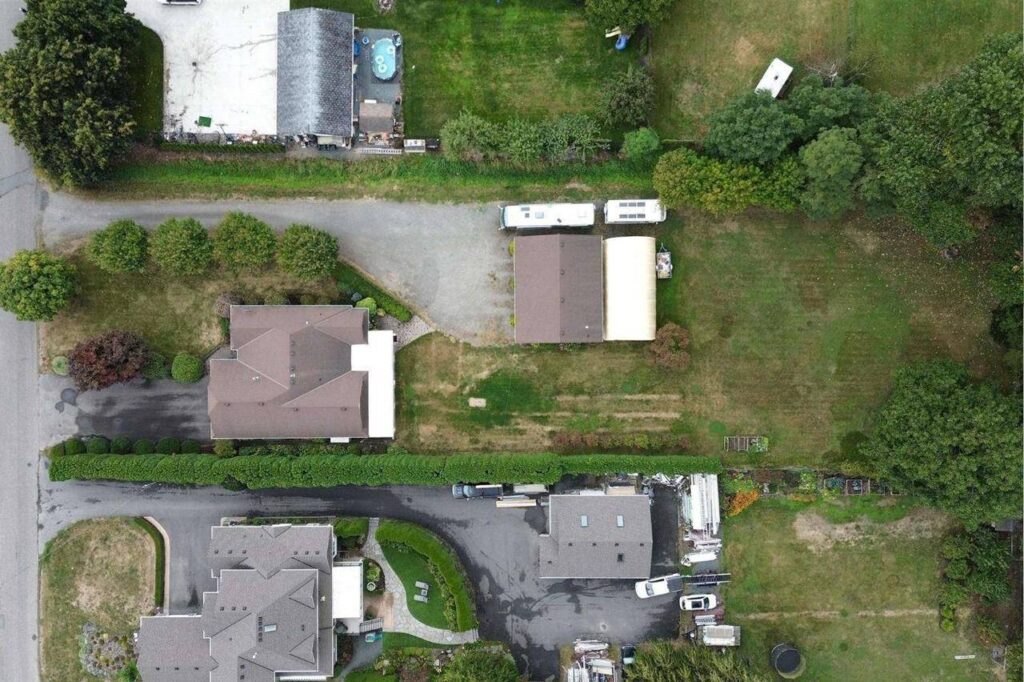 Overhead view of the house, shop and open lawn at 42703 Janzen Road