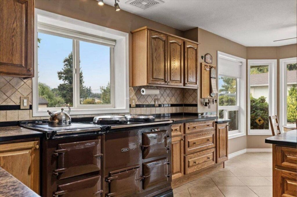 The AGA cooker set into oak cabinetry at 42703 Janzen Road