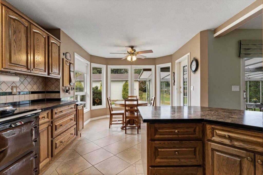 Oak kitchen and bay window breakfast nook at 42703 Janzen Road