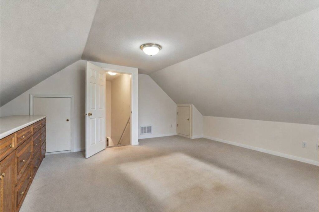 Loft bedroom above the garage with built in cabinetry at 42703 Janzen Road
