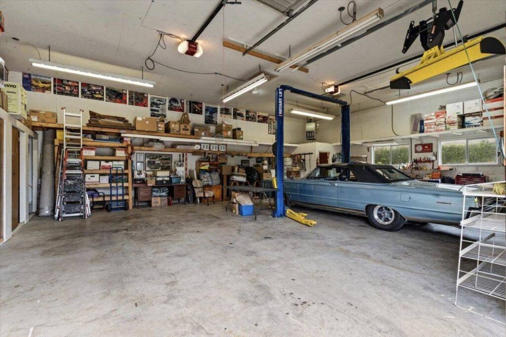 Inside the heated shop with a hoist at 42703 Janzen Road