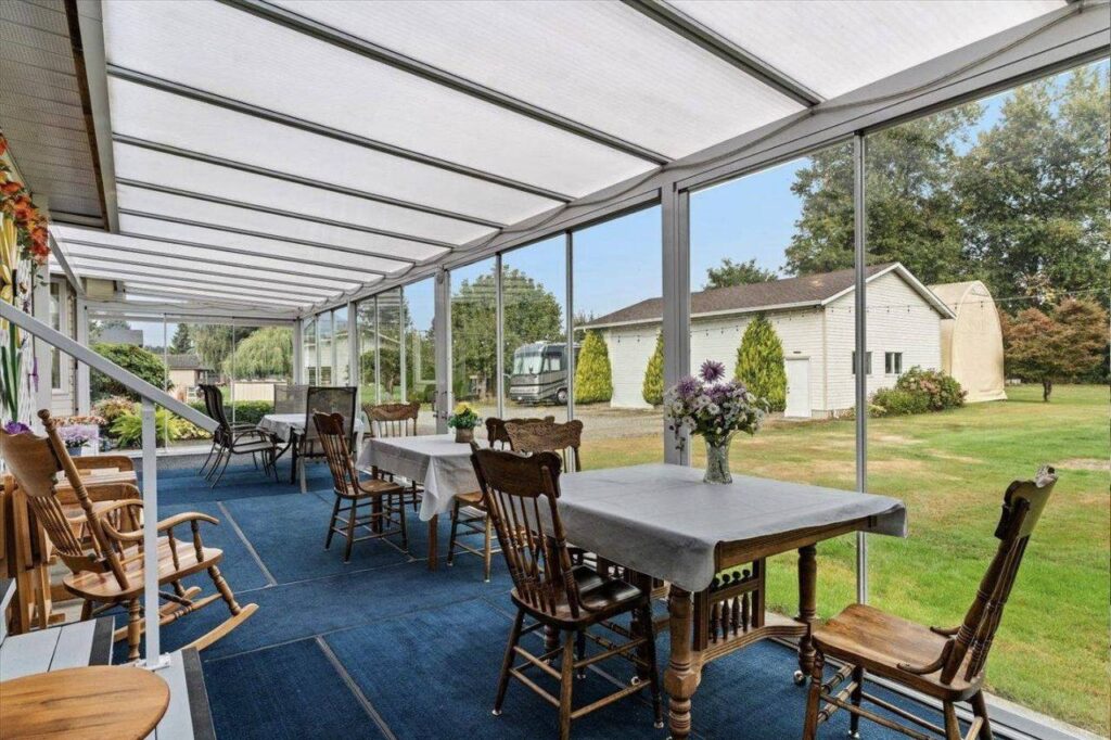 Dining end of the 37 foot Lumon sunroom at 42703 Janzen Road