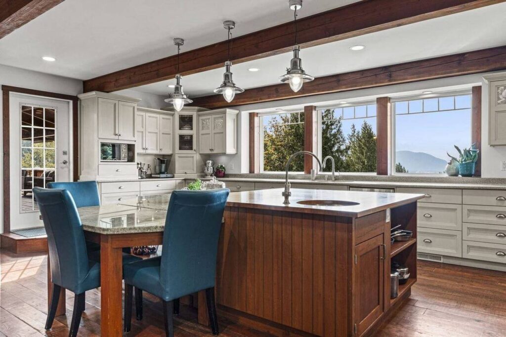 Kitchen island with pendant lights and valley views at 48625 Wincott Road