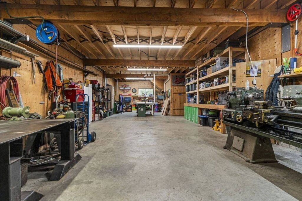 Workshop with concrete floor and timber ceiling at 48625 Wincott Road