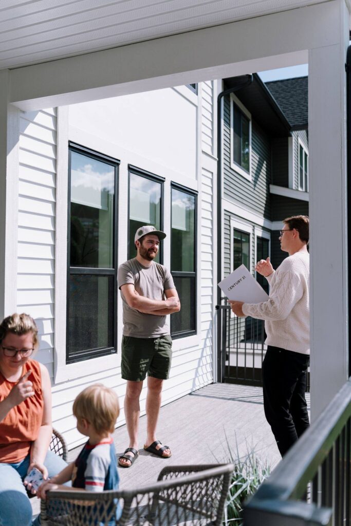 Nahum Hoeppner meeting a family on the front step of a home