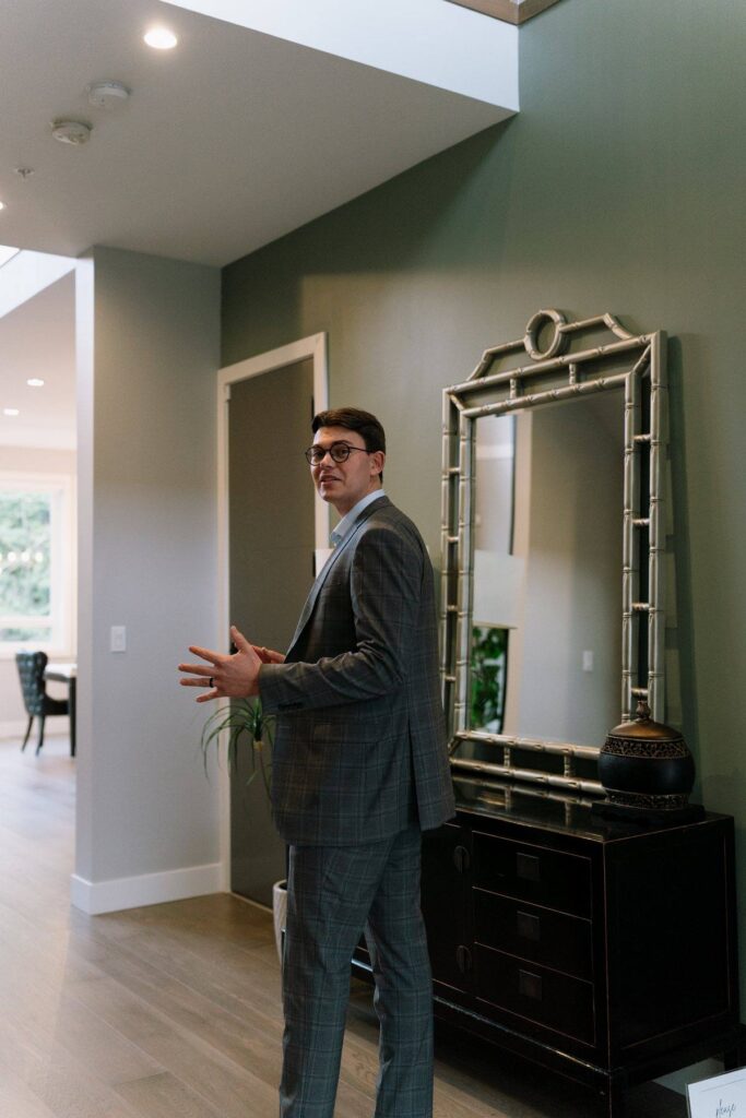 Nahum Hoeppner walking through the entry of a Marble Hill listing