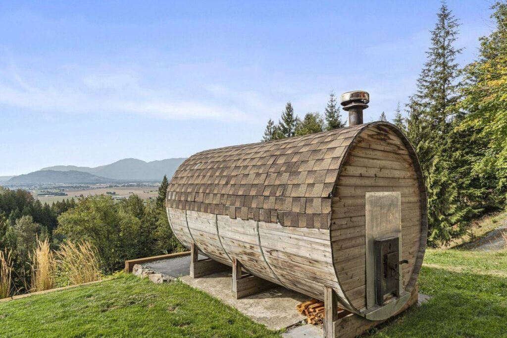 Barrel sauna overlooking the valley on a Ryder Lake acreage